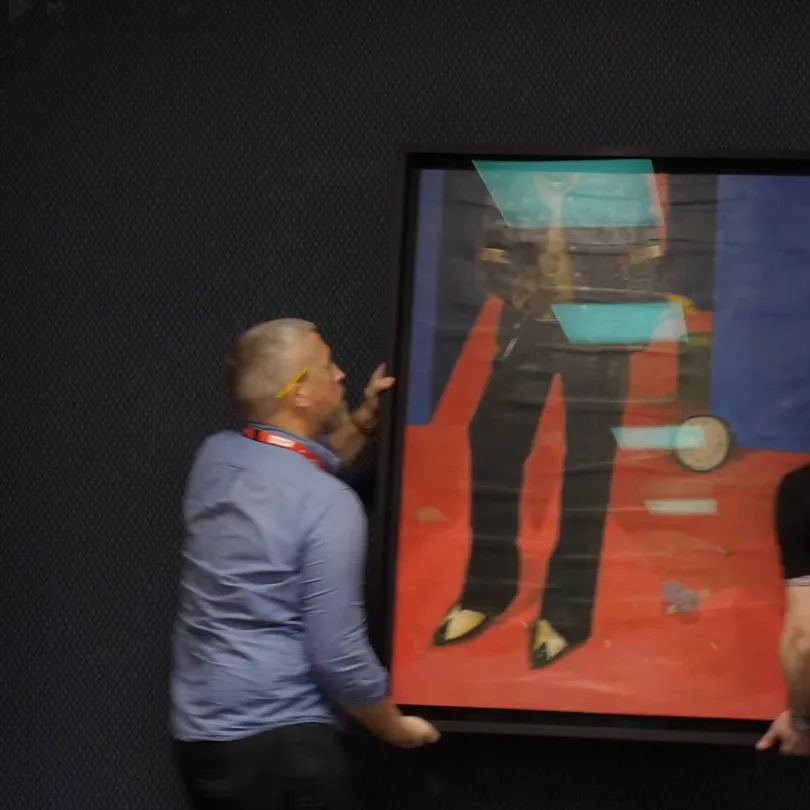 Specialist art handlers transporting paintings