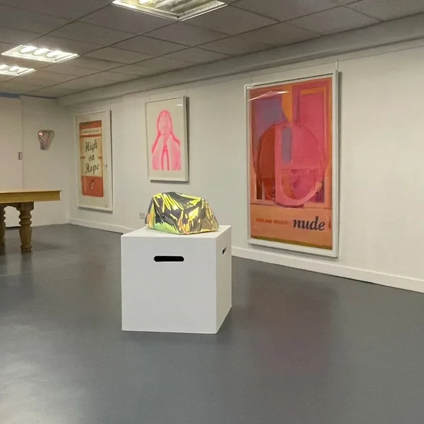 Art technicians handling framed paintings